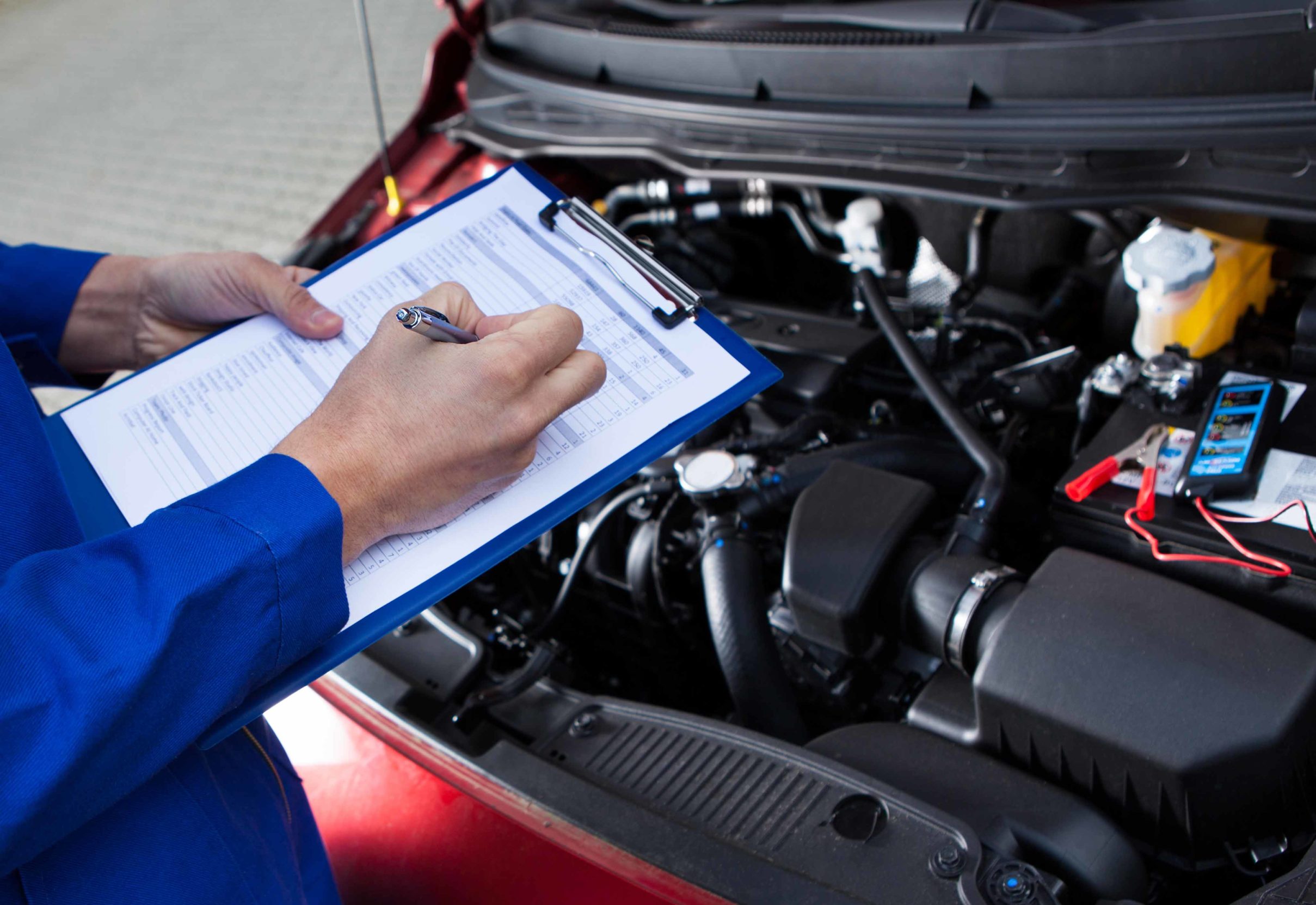 car service technician performing scheduled maintenance in austin texas near cedar park and round rock